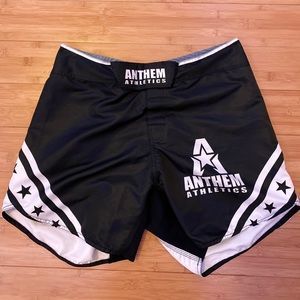 Black and white MMA shorts.